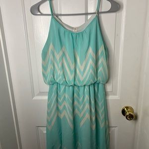 selling a dress I got from a local boutique in my town and it is teal and white